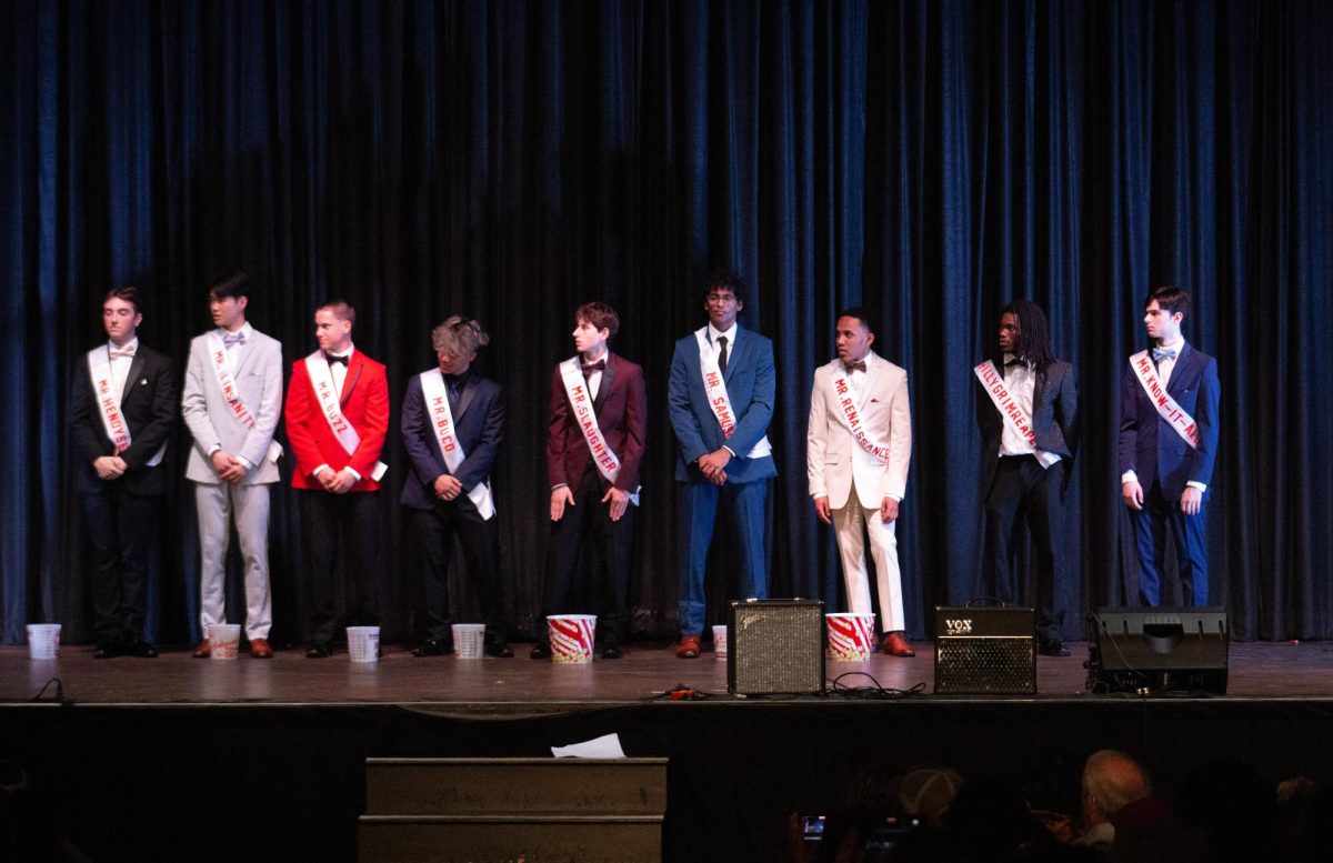The Mr. East contestants line up along the stage at the end of the night before the winner is announced.