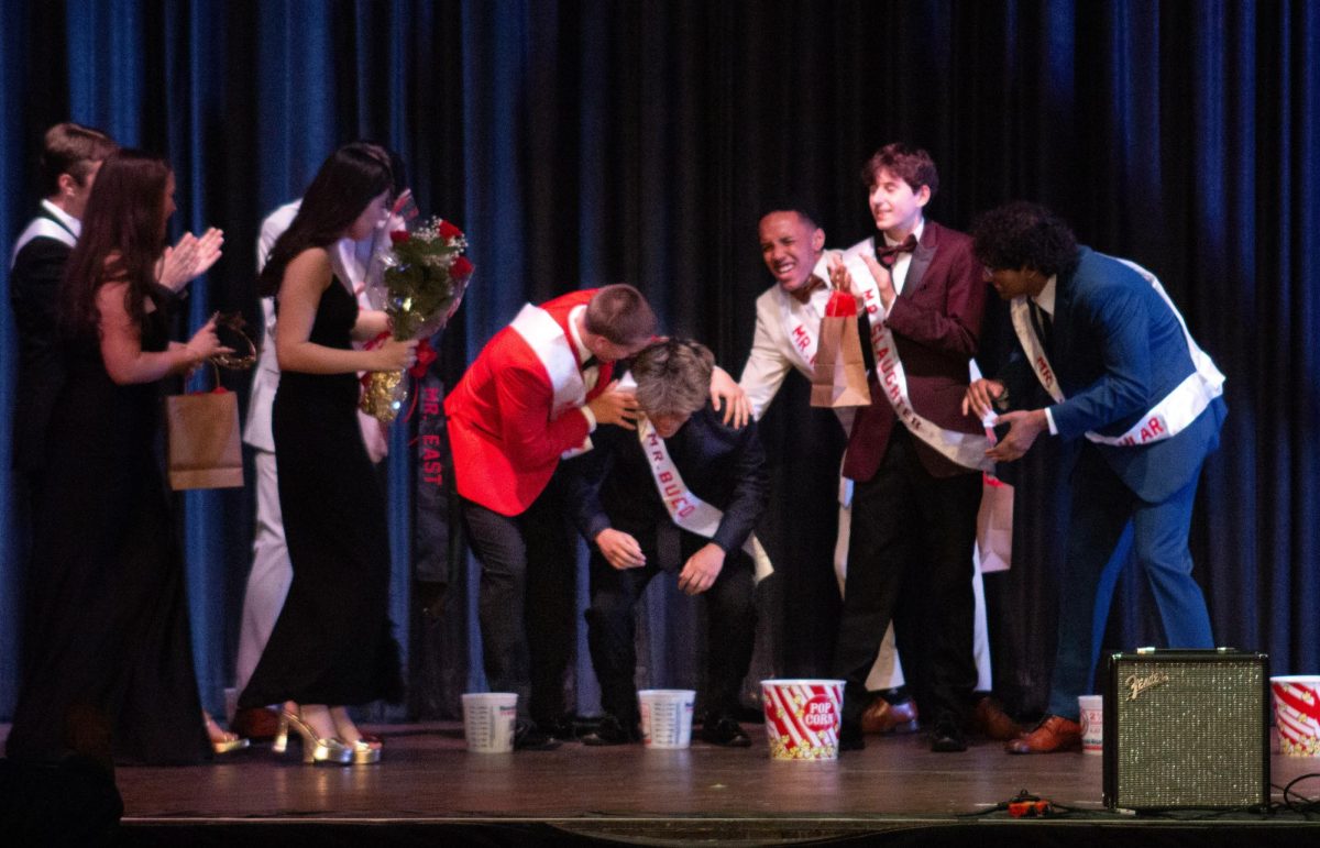 Mr. Buco is overwhelmed with emotion after he is declared Mr. East.