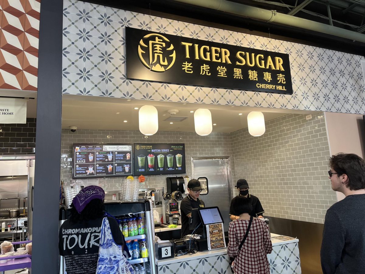 Tiger Sugar employees take orders from customers on H Mart reopening day.