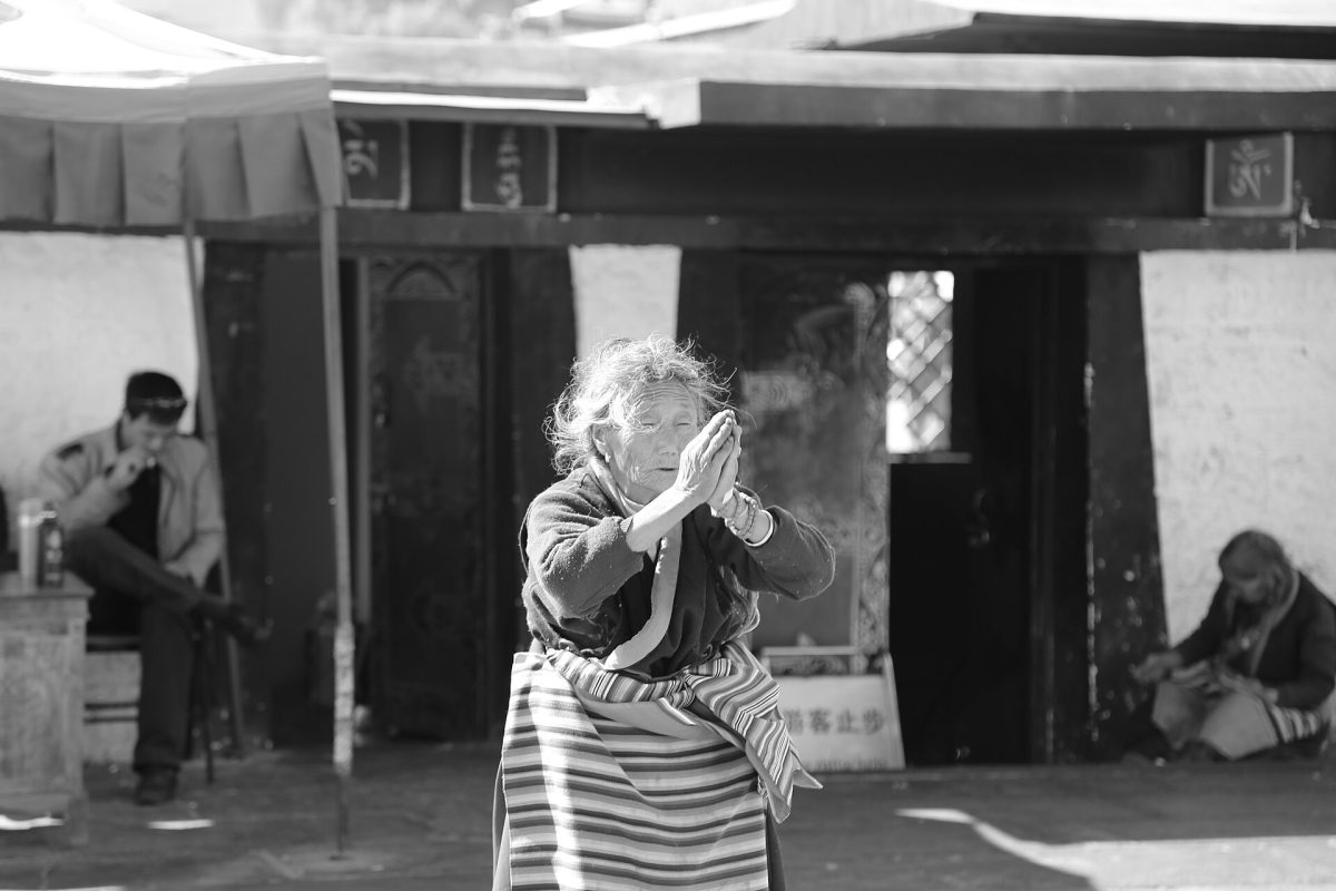 A North Korean woman prays despite persistent prosecution of Christians by the government. "North Korean woman praying" by Pixabay is licensed under Public Domain, CC0 