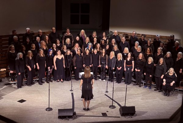 Lockart conducts the Rock Voices choir during the concert.